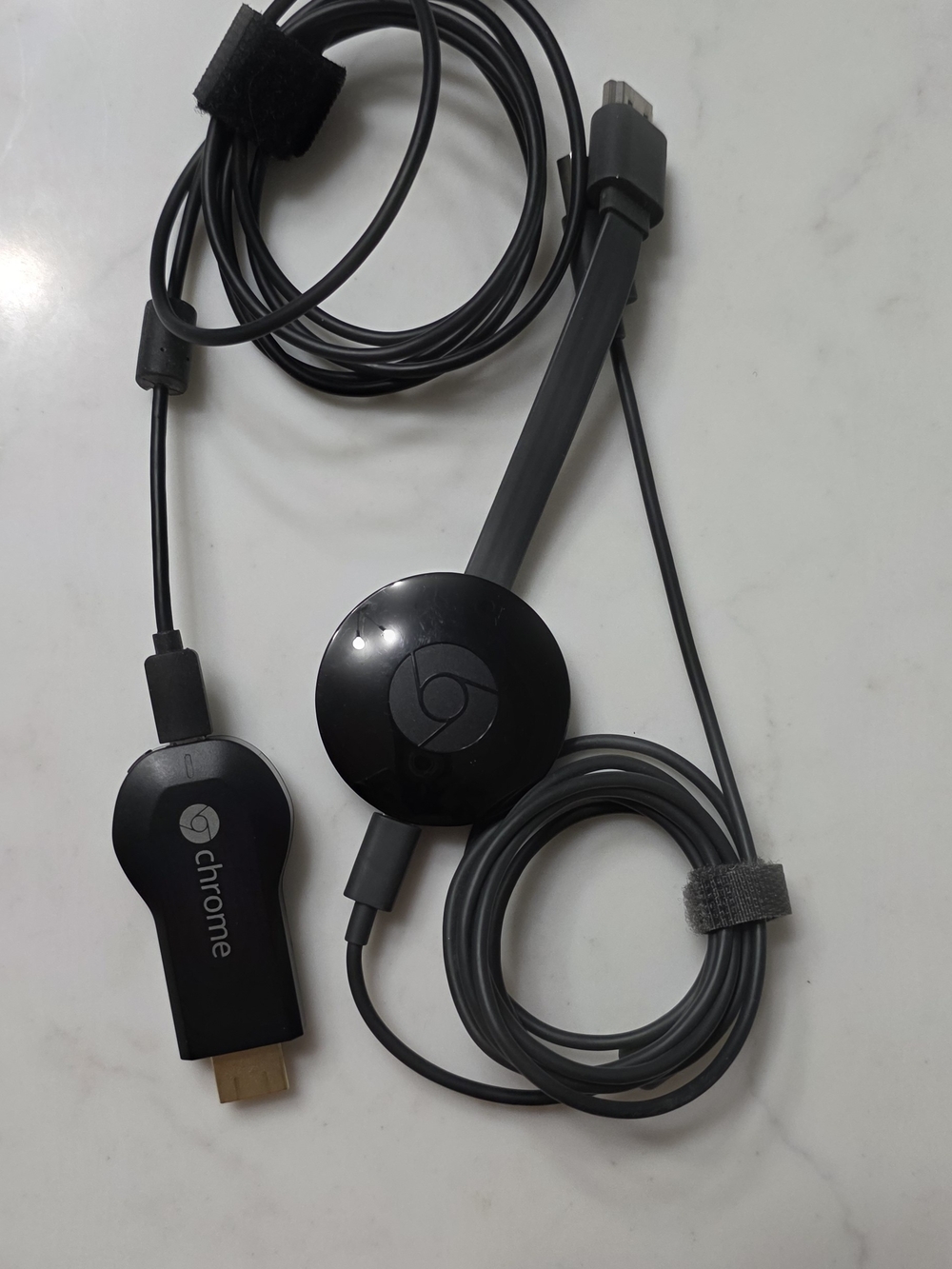 2 - Google Chromecast adapters and HDMI dongles in black